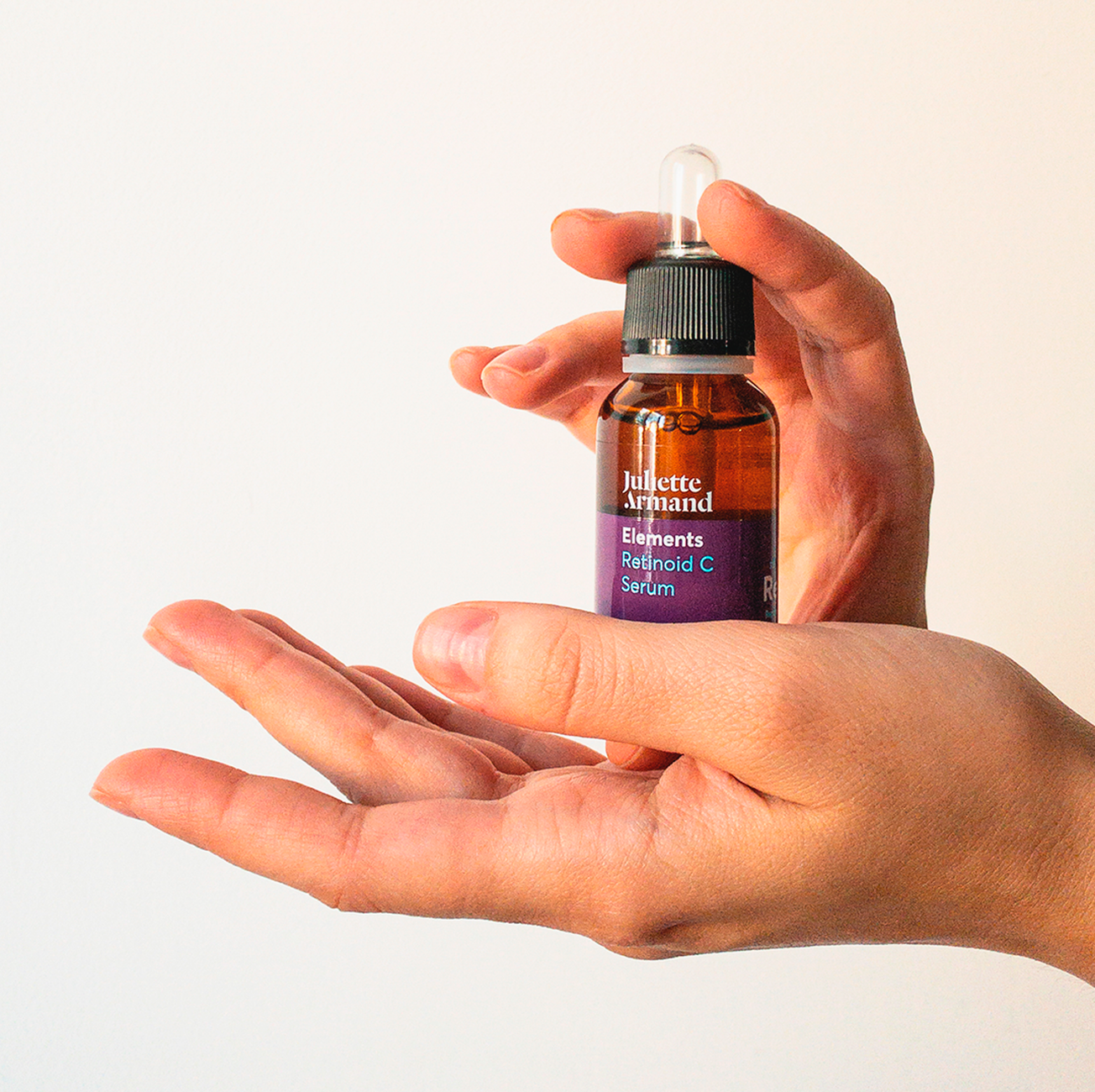 Close-up of a bottle of skincare serum with a dropper