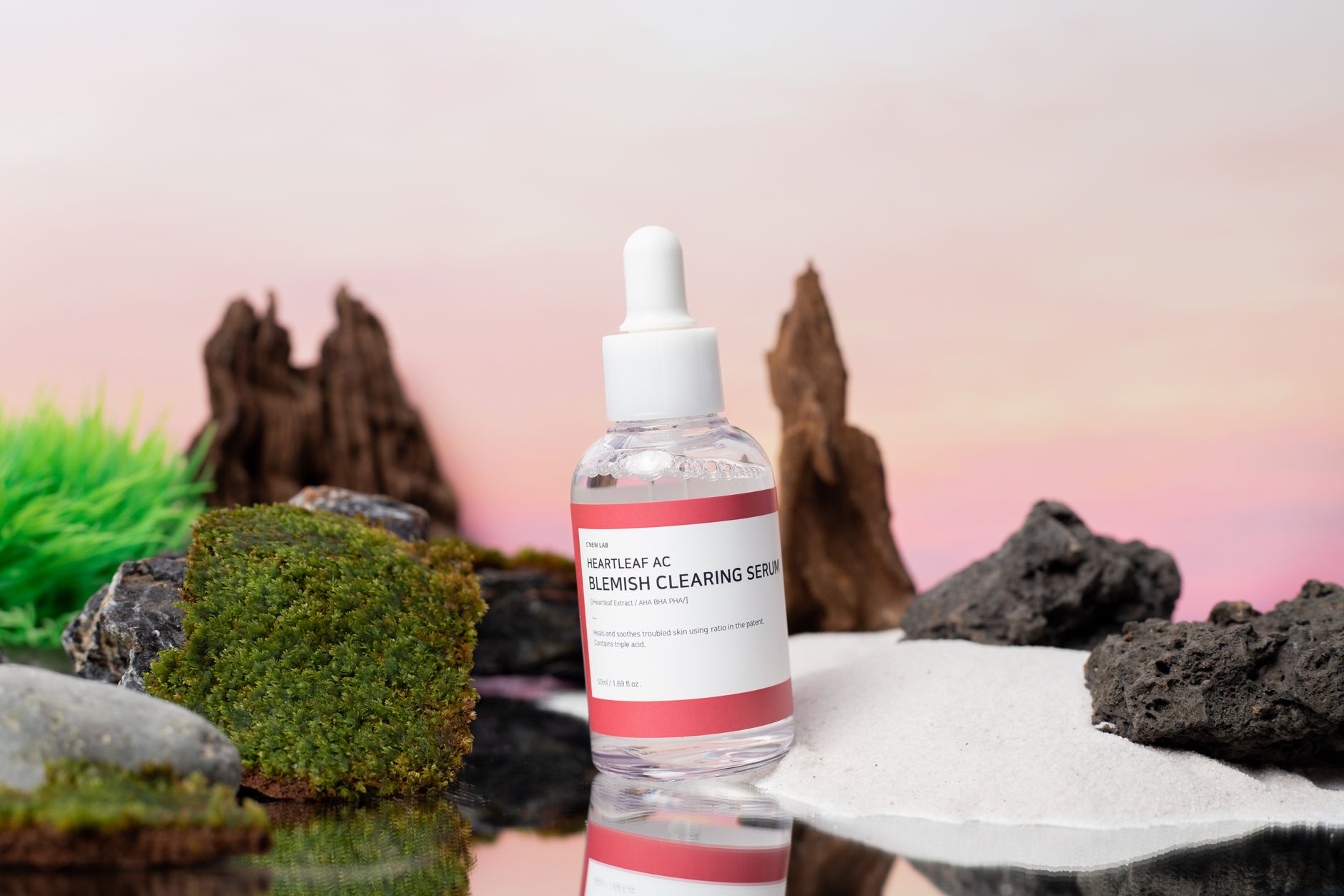 Close-up of a person applying mandelic acid serum to acne-prone skin, showing clear skin texture