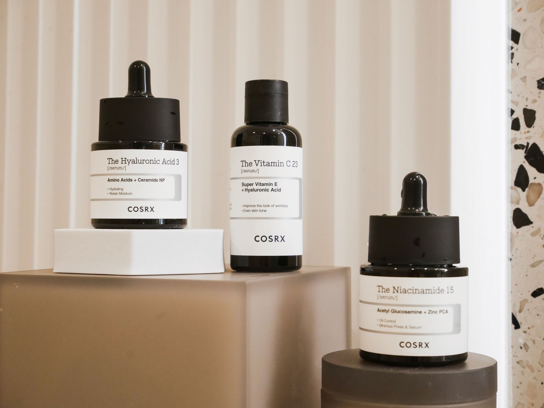 A woman applying gentle skincare serum to her clean face